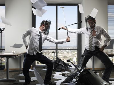 Businessmen Fighting With Golf Clubs 96614907 5812549e5f9b58564ccf062f