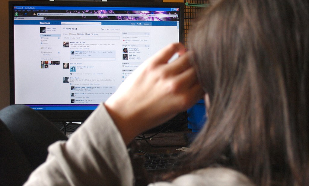 Teenage Girl Using Facebook. Image Shot 2011. Exact Date Unknown.