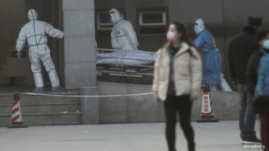 Medical Staff Transfer A Patient At The Jinyintan Hospital, Where The Patients With Pneumonia Caused By The New Strain Of Coronavirus Are Being Treated, In Wuhan