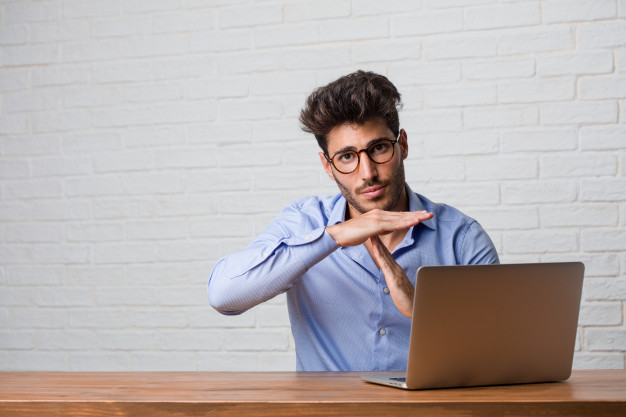 Young Business Man Sitting Working Laptop Tired Bored Making Timeout Gesture Needs Stop Because Work Stress Time Concept_1187 15910