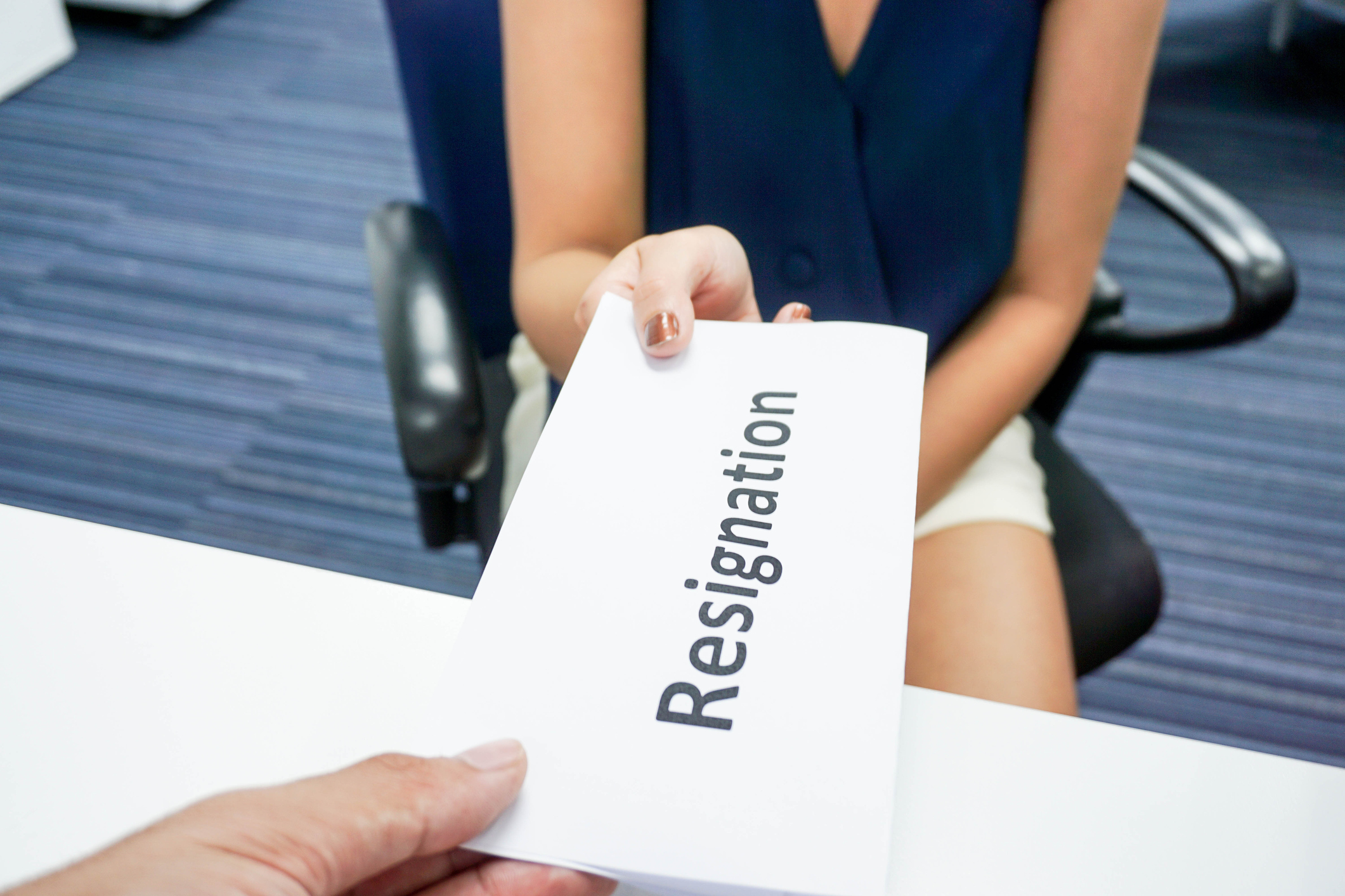 Woman Submit A Resignation Letter To Her Boss